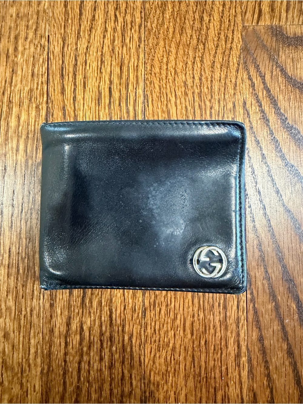 Gucci Black Leather Bi-Fold Wallet with Silver GG Emblem